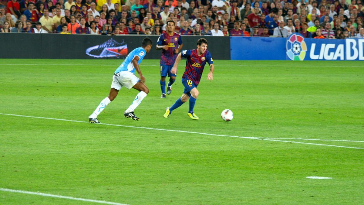 Messi on the pitch for Barcelona against Osasuna in 2011