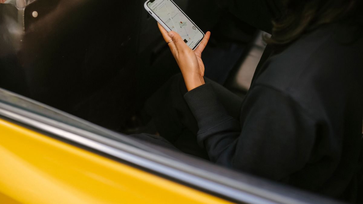 Woman seen from above watching something on her phone
